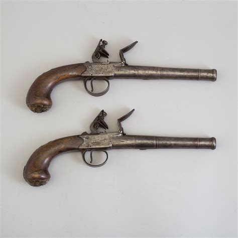 A Pair Of Queen Anne Flintlock Pistols Makers Mark Barker And London