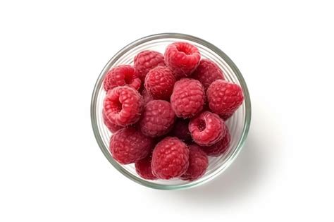 Premium Ai Image A Glass Bowl Filled With Raspberries On Top Of A