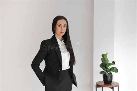 Portrait Of Elegant Business Executive Woman Standing At Office Stock