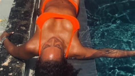 Mel B 48 Puts On A VERY Busty Display In A Bright Orange Bikini As She Soaks Up The Sun During