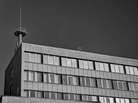 Low Angle Grayscale Shot Of A Brick Building And A Tower In Budapest