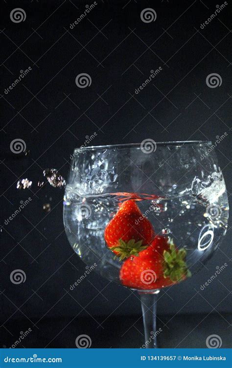 Strawberries Dropping To A Glass Water Splash Stock Image Image Of