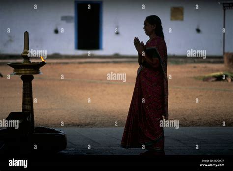 A Silhouette Of A Woman Praying At A Hindu Temple Kerala India Stock