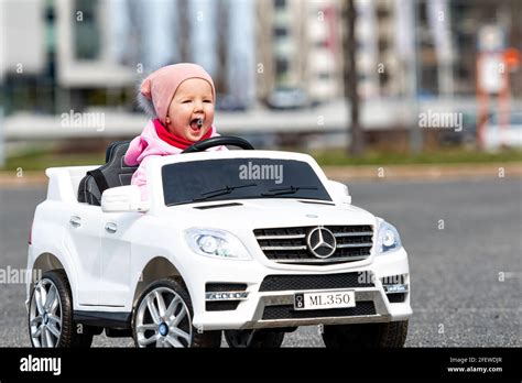 Little Girldriving A Toy Car Little Driver Childrens Car Concept Of