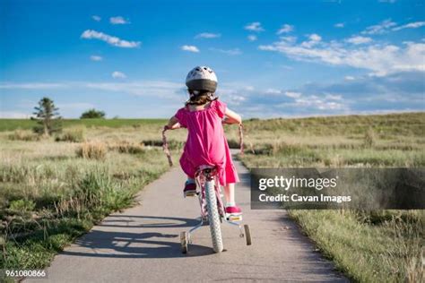 Girls Bike With Training Wheels Photos and Premium High Res Pictures - Getty Images