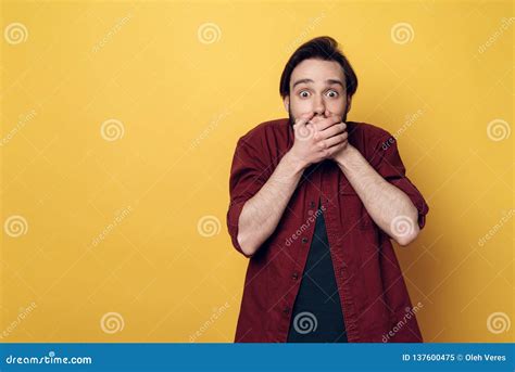 Portrait Of Shocked Young Man Covering Mouth Stock Image Image Of