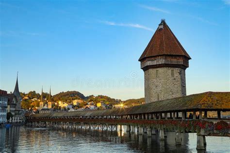 Chapel Bridge Reflecting Up Lake Lucerne in Switzerland with a Sunburst ...