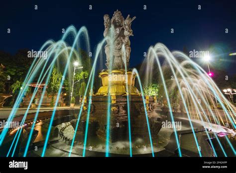 Night View Of Patung Catur Muka Statue And Fountain In Central Denpasar