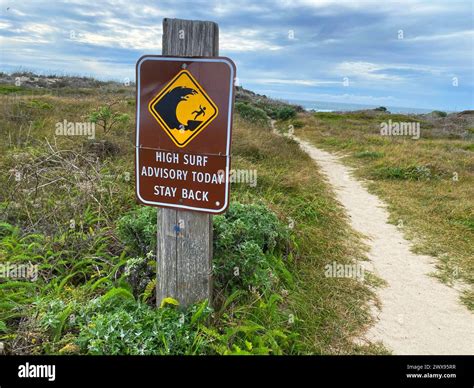 Sign Reading High Surf Advisory Today Stay Back Warning Sign Of High Surf At The Beach