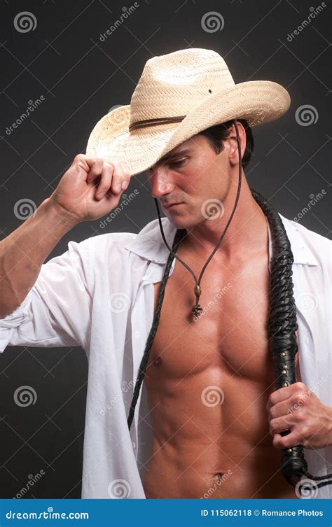 The Cowboy Is Holding On To A Whip Stock Photo Image Of Desire