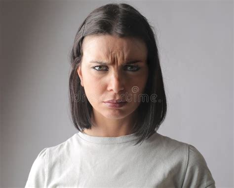 Closeup Of A Hungarian Brunette Looking Into The Camera With A Confused