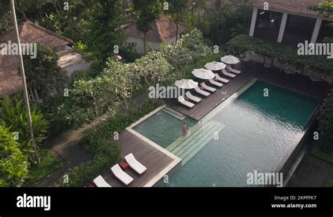 Woman In Bikini Stepping Into Luxury Swimming Pool At Tropical Jungle Stock Video Footage Alamy