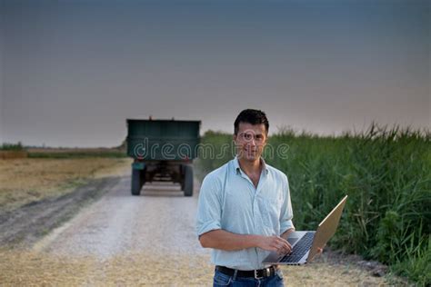 Farmer and Tractor in Field Stock Photo - Image of people, outdoor ...