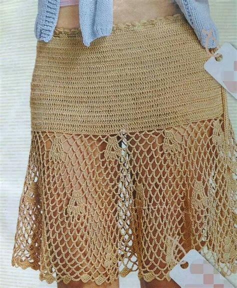 A Close Up Of A Woman S Skirt Made Out Of Crochet