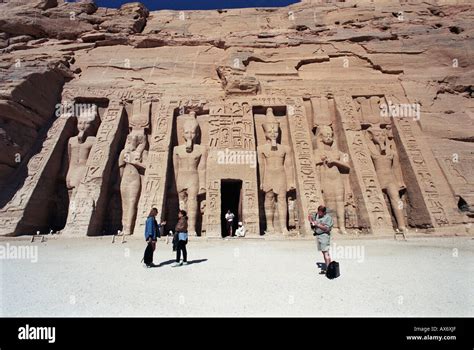 Tourists Dwarfed By Colossal Statues Of Ramesses Ii The Hathor Temple