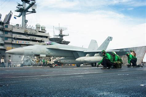 Sailors Prepare An Fa E Super Hornet Photograph By Stocktrek Images