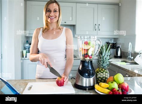 Pretty Blonde Woman Preparing A Smoothie Stock Photo Alamy