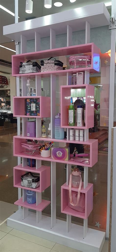 Pink And White Display Case In A Store