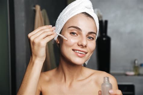 Premium Photo Photo Of Caucasian Woman With Towel On Head Applying