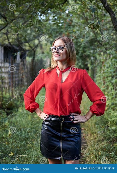 Three Quarter Portrait Of Pretty Blond Woman In Eyeglasses Red Shirt