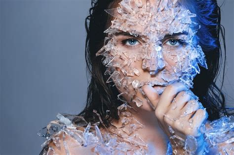 Premium Photo Portrait Of Woman With Broken Glass On Body Against Purple Background