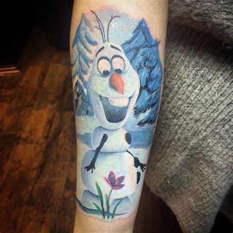 A Tattoo With A Snowman On Its Arm