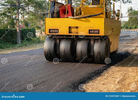 Heavy Vibration Yellow Steamroller Or Soil Compactor Working On Hot Mix