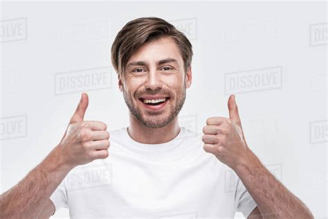 Handsome Smiling Man Showing Thumbs Up Isolated On White Stock Photo