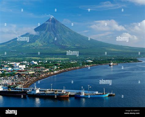 The City Of Legazpi With Mt Mayon The Philippines Most Active Volcano