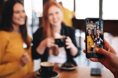 Friends being photographed at a cafe – Jacob Lund Photography Store- premium stock photo