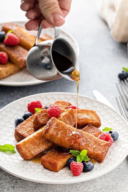 Premium Photo French Toast Sticks With Maple Syrup And Berries