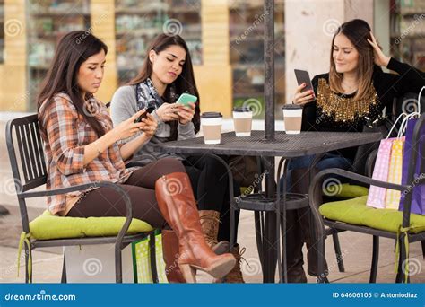 Using Their Smartphones And Ignoring Each Other Stock Image Image Of