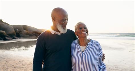 Premium Photo Senior Couple Smile And Hug On Beach Love And Bonding