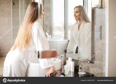 Woman Looking In The Mirror