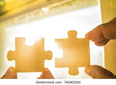 Two Hands Trying Connect Couple Puzzle Stok Fotoğrafı 742402345