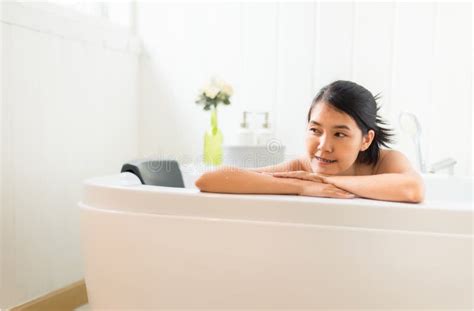 Beautiful Asian Woman Relaxing On Bubble Bathtub In The Morning Female