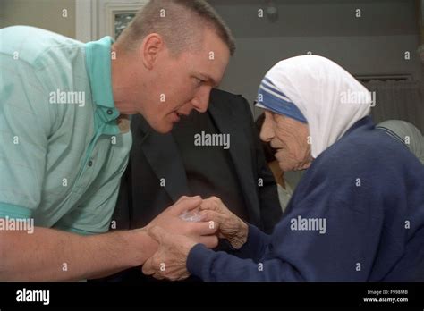 Mother Teresa Shaking Hands With A Volunteer At Grace House In Atlanta