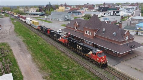 Awesome Aerial K View Long Stack Train Cn W Dpu Passing Via