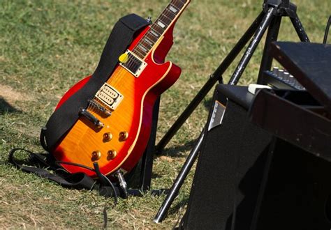 Premium Photo | Guitar in the green grass