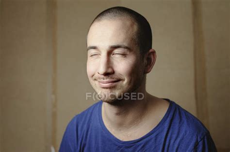 Portrait Of Man With Closed Eyes Focus On Foreground — Horizontal