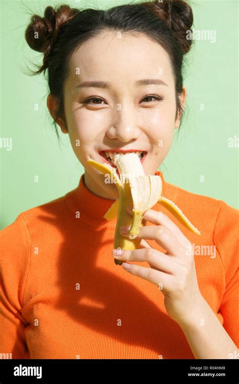 Chinese woman eating banana hi-res stock photography and images - Alamy