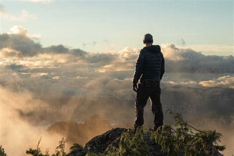 Man Standing Alone On Cliff