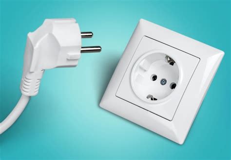 premium photo white electrical plug   electric socket