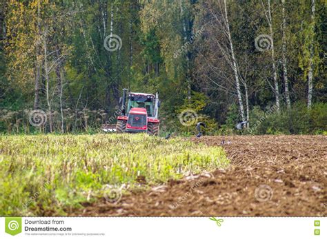 Plowing With An Old Tractor Editorial Image | CartoonDealer.com #28402296