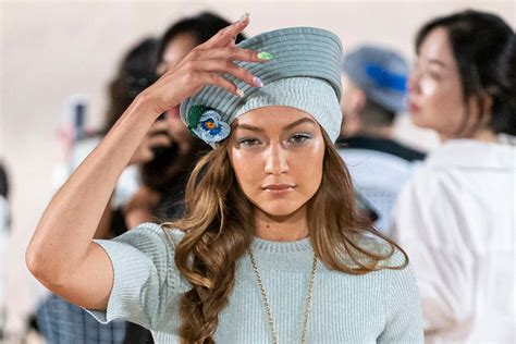 Gigi Hadid Suffers A Wardrobe Malfunction With Her Shoes At NY Fashion Week