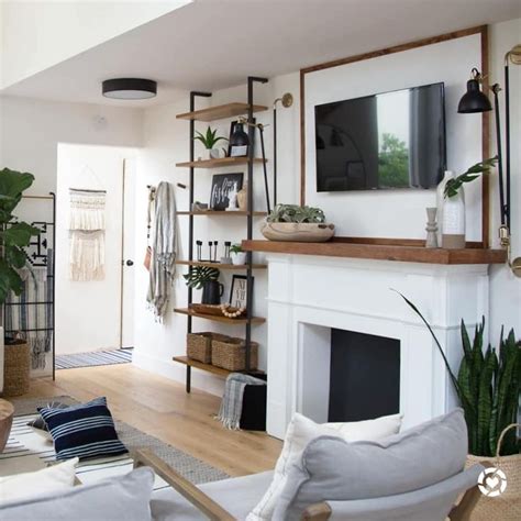 A Living Room Filled With Furniture And A Flat Screen Tv Mounted On A