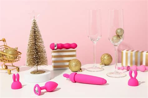 Premium Photo Sex Toy With Christmas Decor On A Pink Background