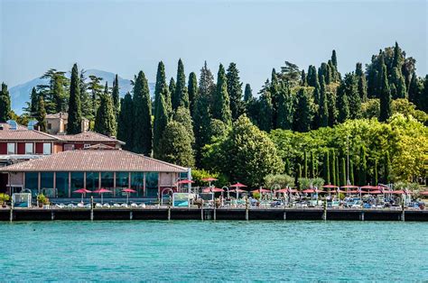 Waterside view of Acquaria Terme - a spa resort in the town of Sirmione ...