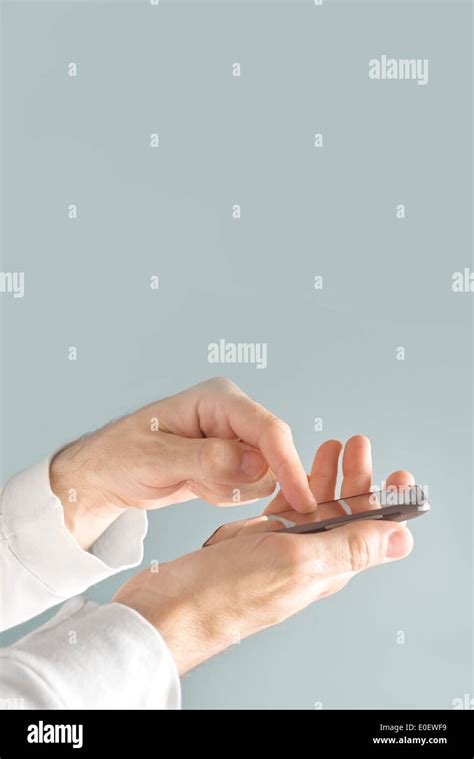 Hands Holding Mobile Smart Phone And Taping The Screen Stock Photo Alamy