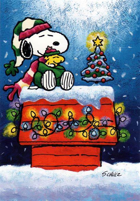 Snoopy And Woodstock All Bundled Up In The Snow By The Christmas Tree